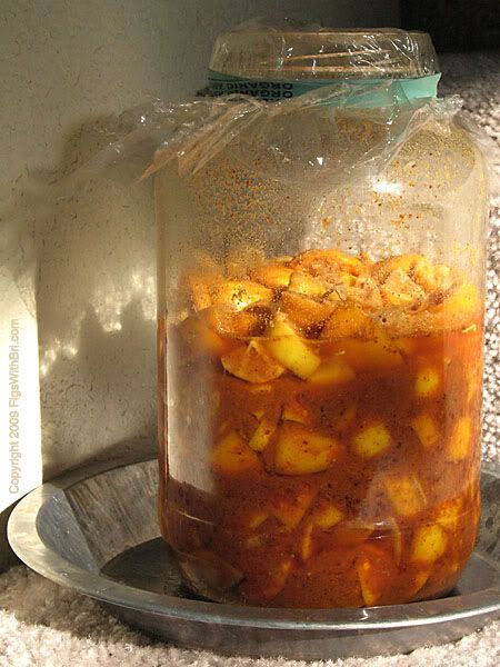 Traditional Indian Lemon Pickle cooking the sun\'s warmth
